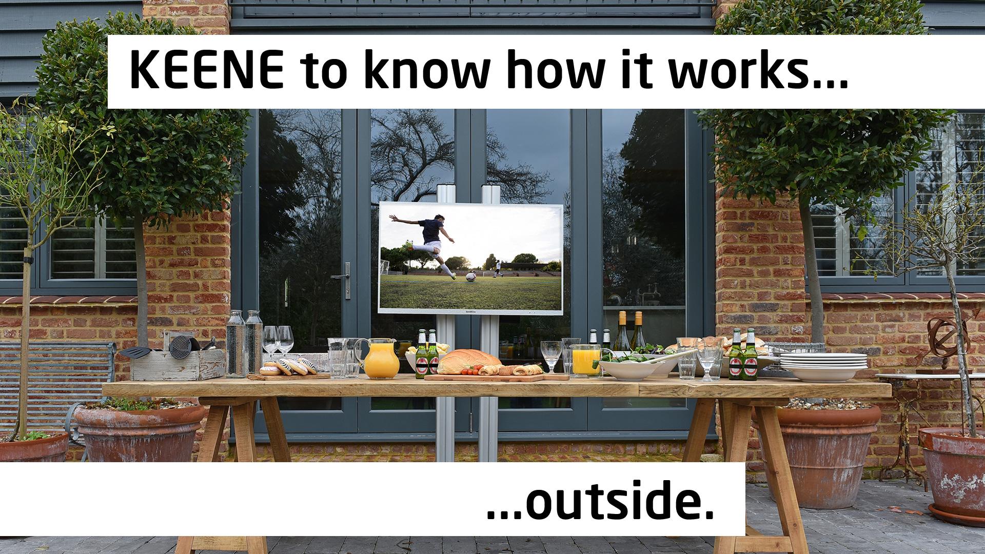 Proofvision Waterproof TV outside with a dining table in front